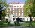 The film crew pauses at the bust of Mr. Long in the park in front of the Monticello Hotel