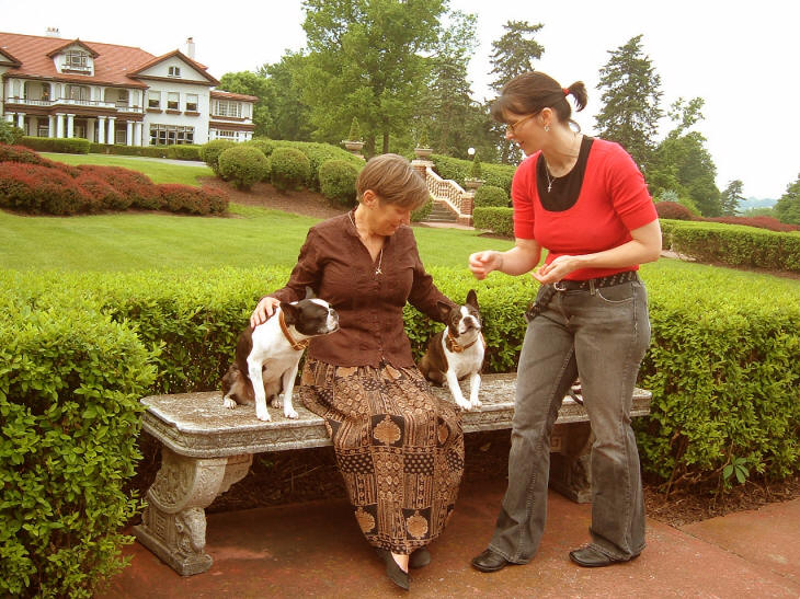 Author Linda Newcom Mason is interviewed in the sunken garden with George and Humbug.