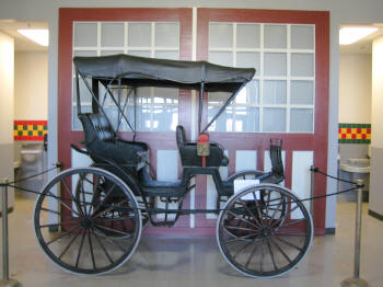 Cabriolet carriage at the school against original Show Barn doors