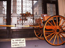 Meadowbrook Cart with picnic basket posed on the seat