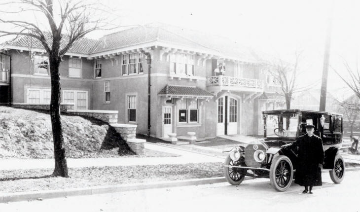 R. A. Longs Pierce Arrow limousine in front of garage, before 1914