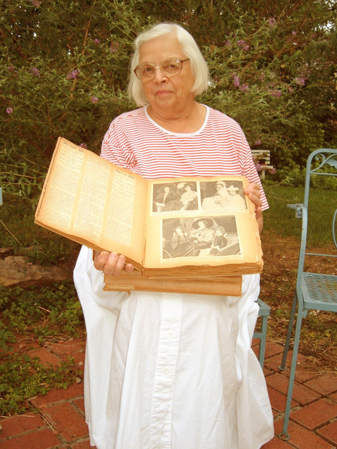 Virginia with her grandmothers scrapbooks